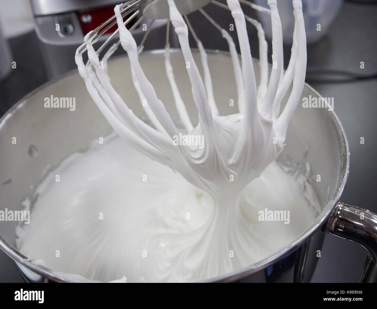 Beating egg whites using a professional mixer Stock Photo Alamy