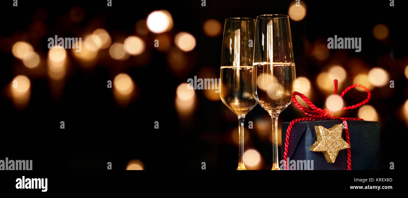 christmas present with champagne glasses Stock Photo