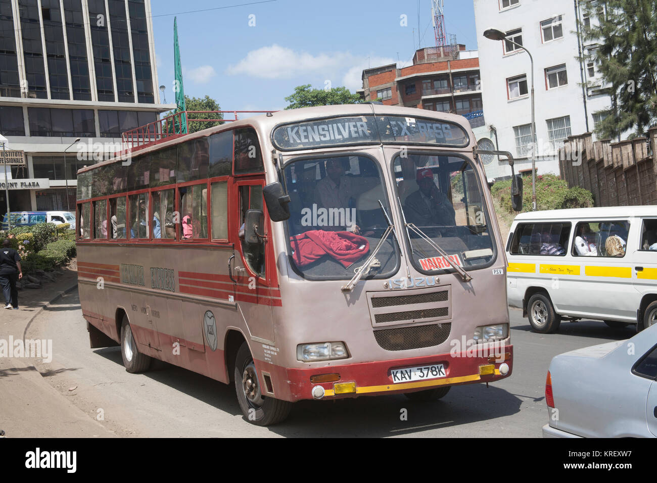 Brightly coloured traditional shared taxis or matatu buses in the capital of Kenya, Nairobi, East Africa Stock Photo