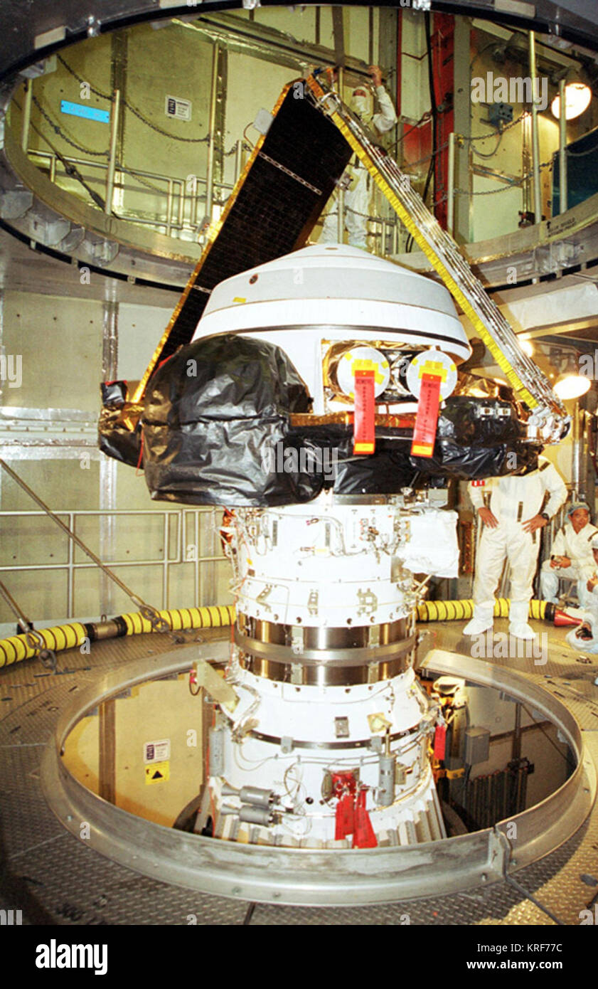 KSC-01PP-1343 (07/19/2001) --- KENNEDY SPACE CENTER, Fla. -- After its canister has been removed, the Genesis spacecraft sits in place atop the Boeing Delta II rocket in the tower at Launch Complex 17-A, Cape Canaveral Air Force Station. Genesis will be on a robotic NASA space mission to catch a wisp of the raw material of the Sun and return it to Earth with a spectacular mid-air helicopter capture. The sample return capsule is 4.9 feet (1.5 meters) in diameter and 52 inches (1.31 meters) tall. The mission�s goal is to collect and return to Earth just 10 to 20 micrograms -- or the weight of a  Stock Photo