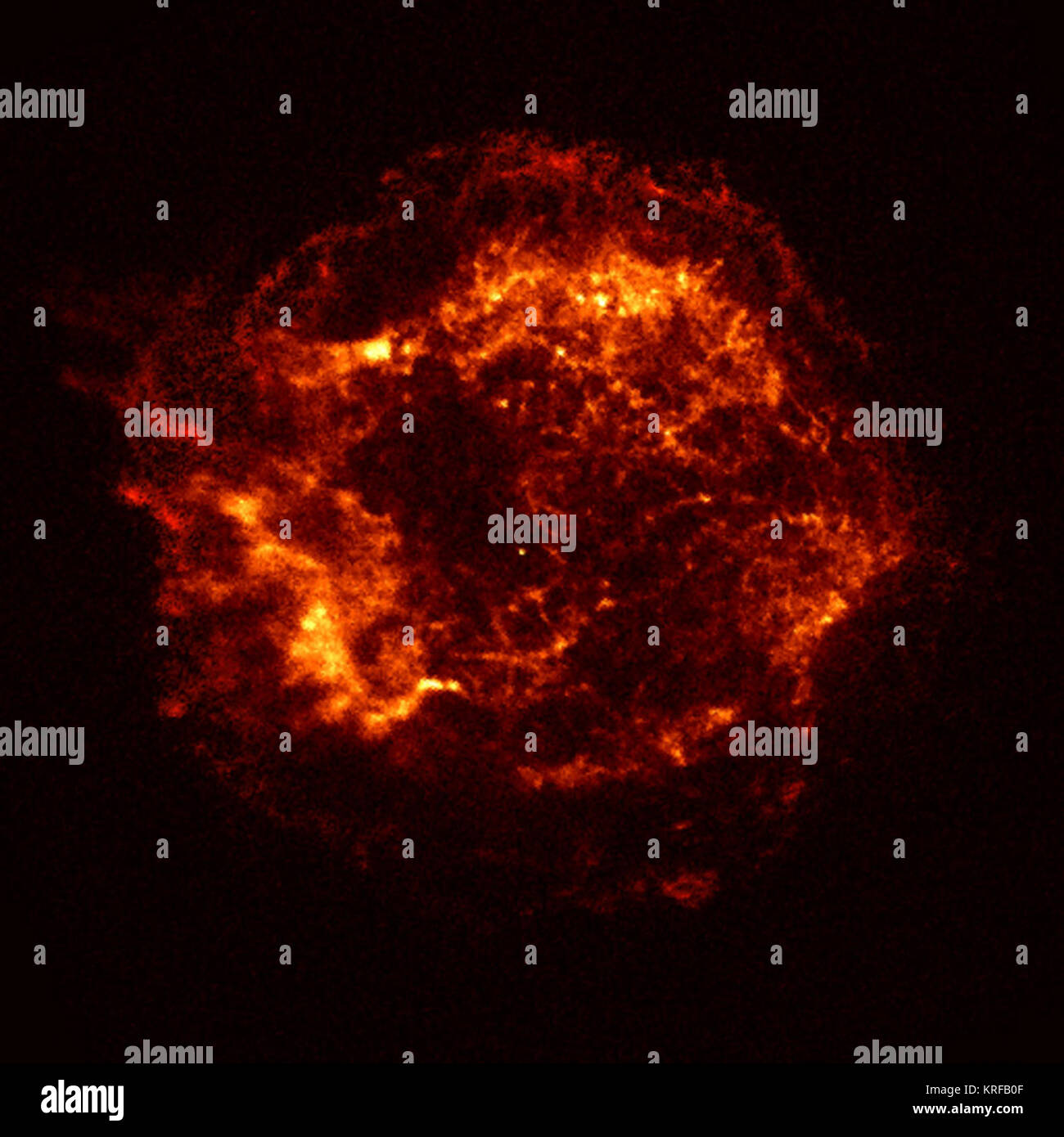 This X-ray image of the Cassiopeia A (Cas A) supernova remnant is the official first light image of the Chandra X-ray Observatory. The 5,000 second image was made with the Advanced CCD Imaging Spectrometer (ACIS). Two shock waves are visible: a fast outer shock and a slower inner shock. The inner shock wave is believed to be due to the collision of the ejecta from the supernova explosion with a circumstellar shell of material, heating it to a temperature of ten million degrees Celsius. The outer shock wave is analogous to an awesome sonic boom resulting from this collision. The bright object n Stock Photo