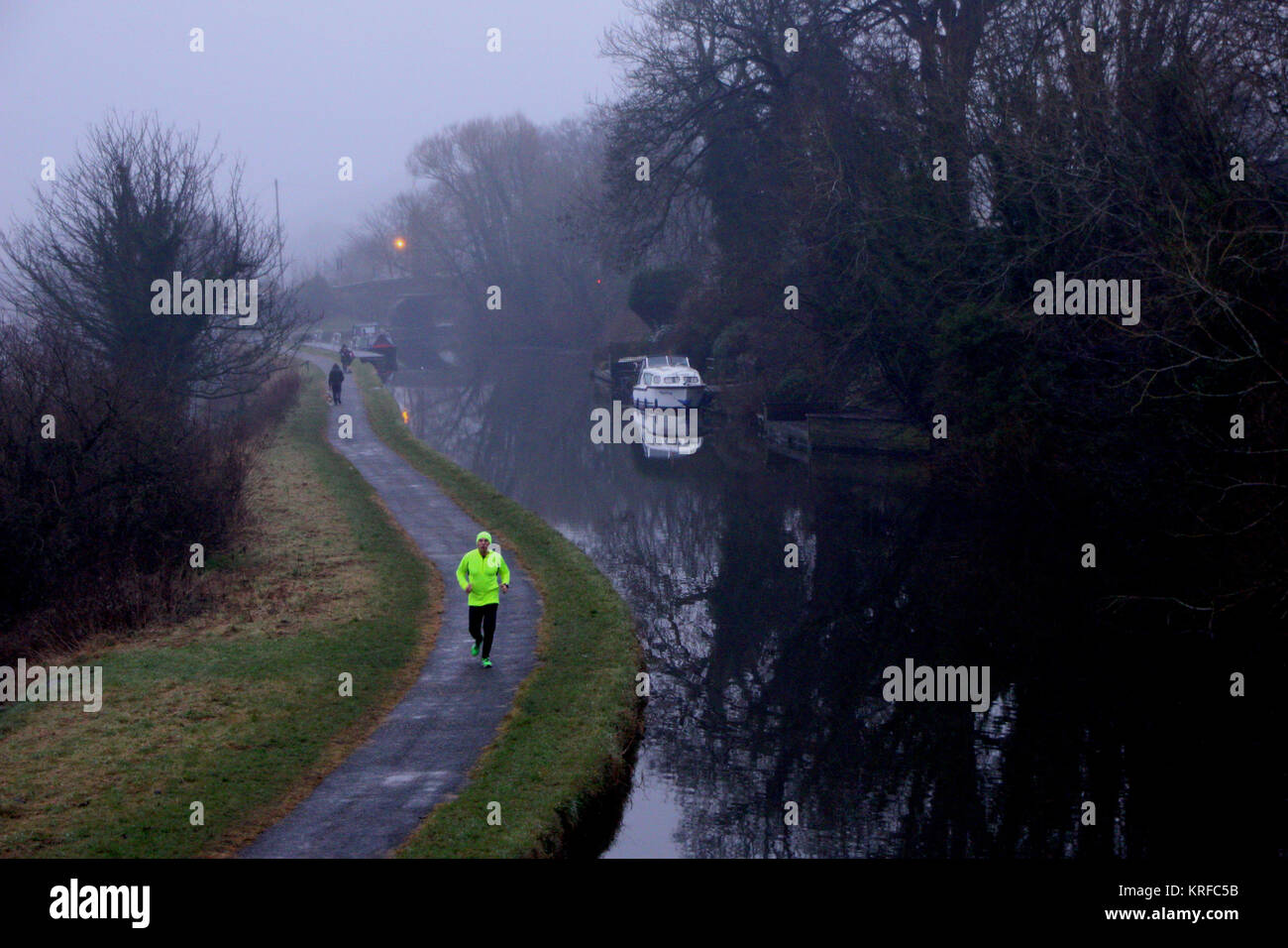 Bolton le sands Lancashire, United Kingdom. 19th December, 2017. Looking through the mist and rain down the tow path of the Lancaster Canal at Bolton le Sands Credit: David Billinge/Alamy Live News Stock Photo