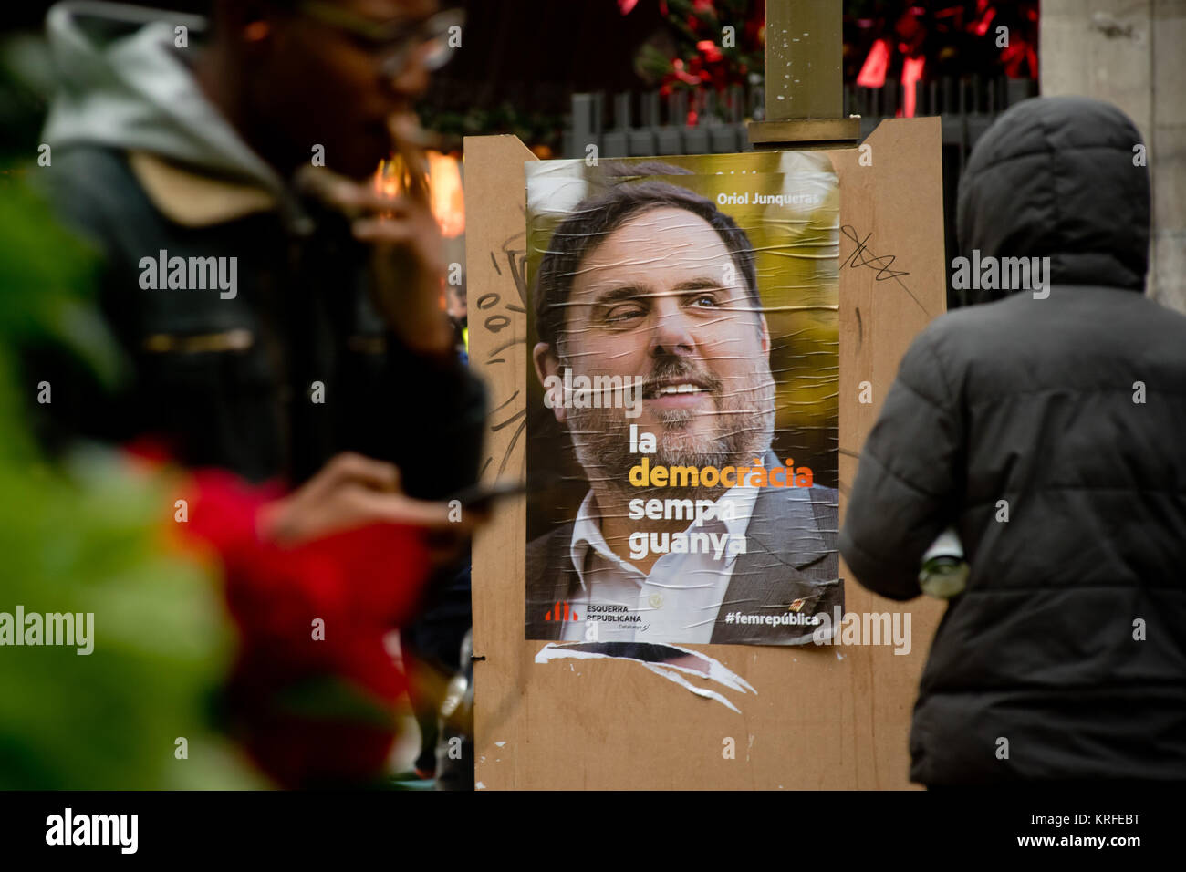 December 18, 2017 - Barcelona, Catalonia, Spain -  An election campaign poster showing former regional vice-president and candidate of ERC party Oriol Junqueras on 18 December 2017 in Barcelona, Spain, ahead of December 21 Catalan regional vote. Oriol Junqueras stays in prison accused of rebellion, sedition and embezzlement for Catalonian pro-independence process. Catalonia will vote in regional elections Thursday, two months after separatist campaigners tried to declare independence from Madrid. Many of the leaders of the secessionist movement were arrested and Spanish government took control Stock Photo