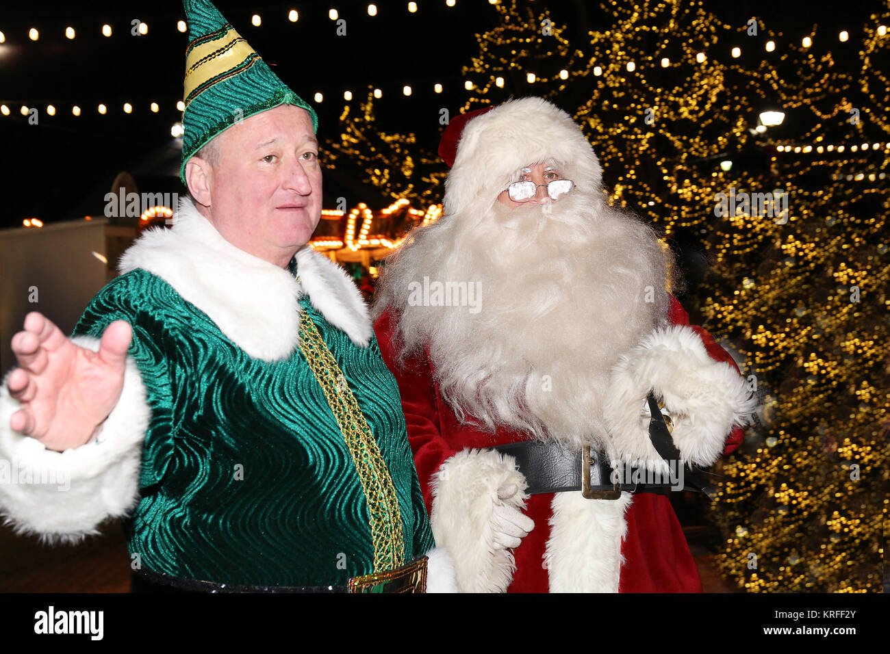 Philadelphia, PA, USA. 19th Dec, 2017. Mayor James Kenney, pictured as Buddy the Elf and City Councilman Mark Squilla pictured as Santa Claus greet visitors at the Franklin Square Electrical Spectacle in Philadelphia, Pa on December 19, 2017 Credit: Star Shooter/Media Punch/Alamy Live News Stock Photo