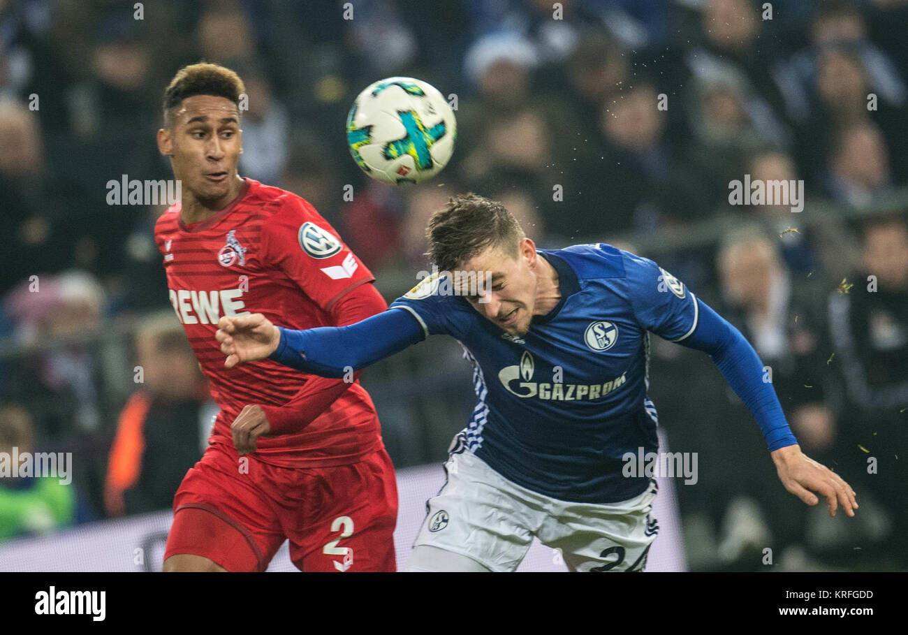 Gelsenkirchen, Germany. 19th Dec, 2017. Schalke's Bastian Oczipka (r) and Cologne's Kevin Goden in action during the German DFB Cup soccer match between FC Schalke 04 and 1. FC Cologne in the Veltins Arena in Gelsenkirchen, Germany, 19 December 2017. Credit: Bernd Thissen/dpa/Alamy Live News Stock Photo