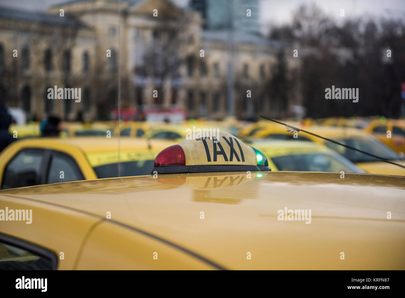 Bucharest, Romania - December 20, 2017: Romanian taxi drivers protest in front of the government headquarters against Uber and other apps that steal their clients. Stock Photo