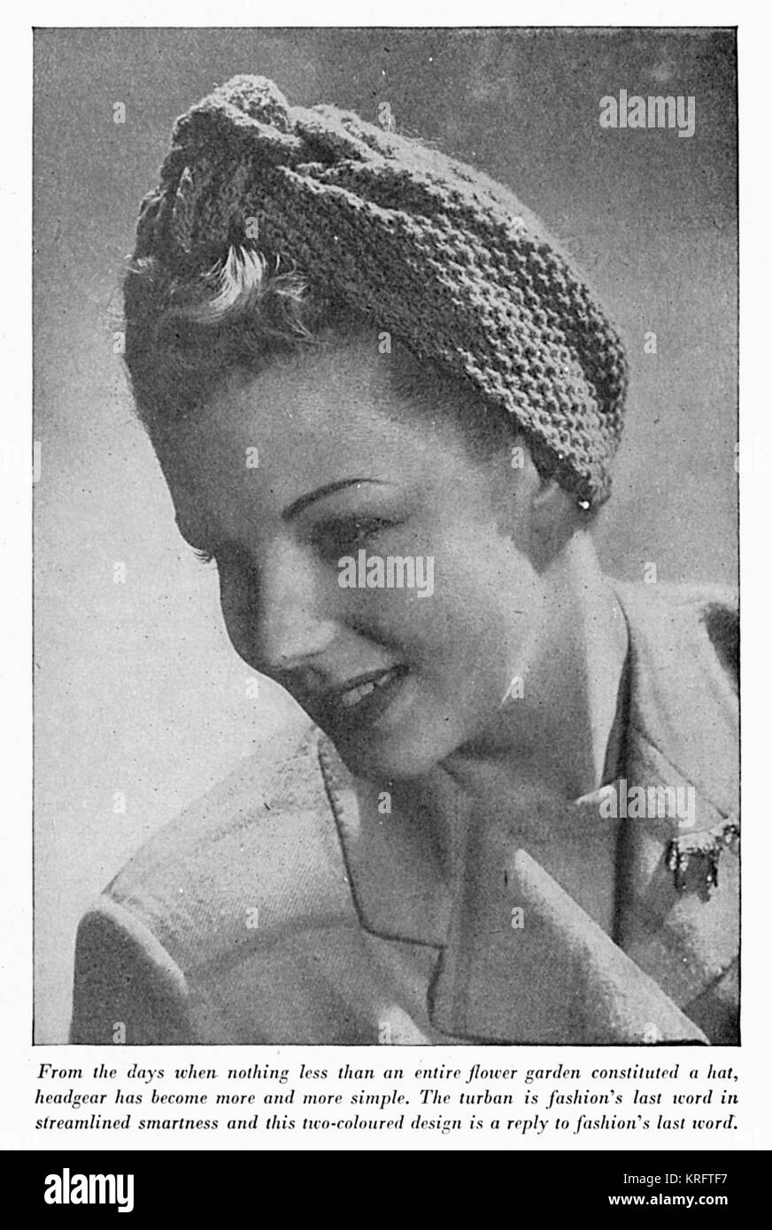A lady models a knitted two-colour turban, circa 1941.     Date: c. 1941 Stock Photo