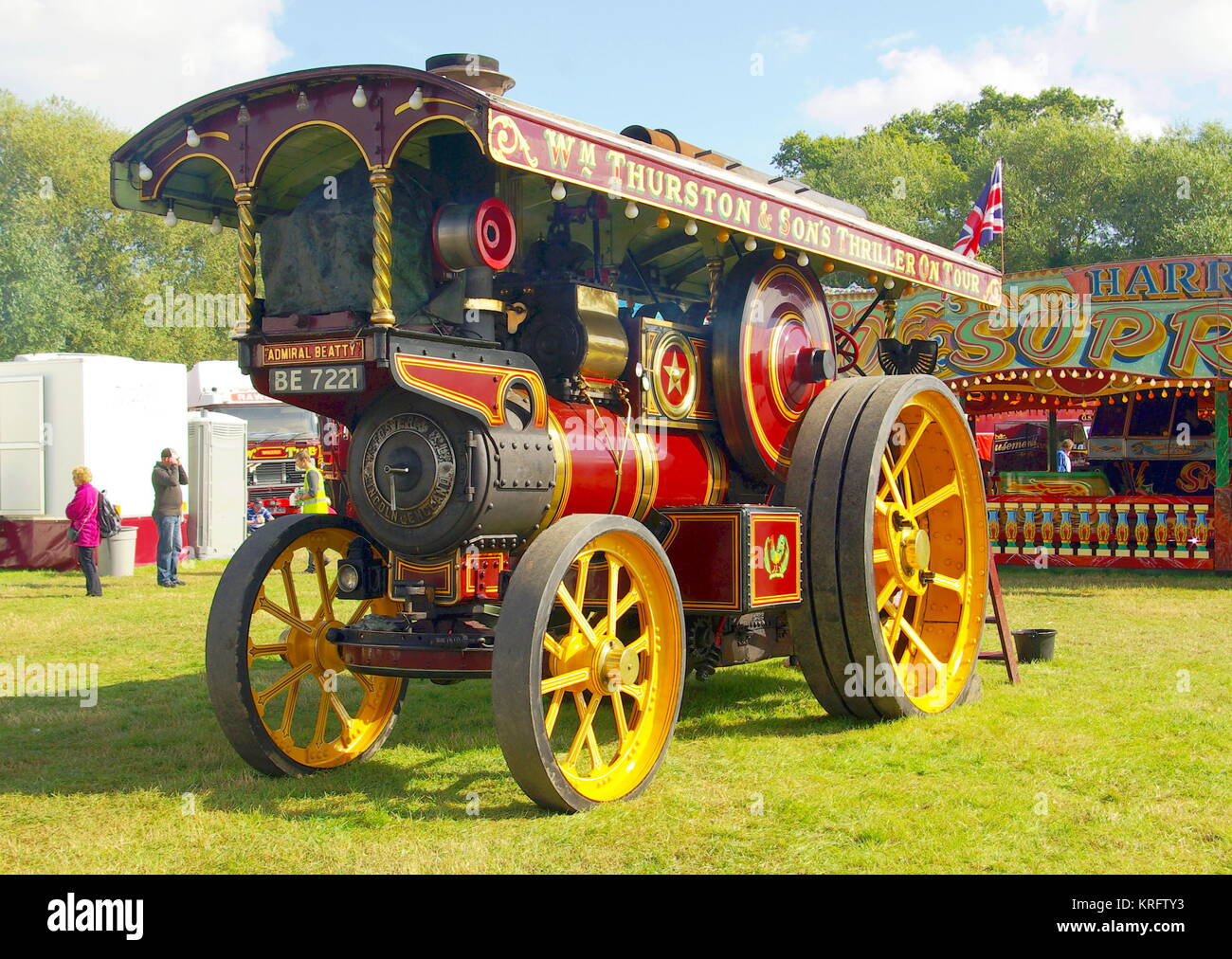 Welland Steam Fair, near Malvern, Worcestershire, with all kinds of farming vehicles and fairground engines on display. Seen here is a fairground engine with a fairground ride in the background. Stock Photo