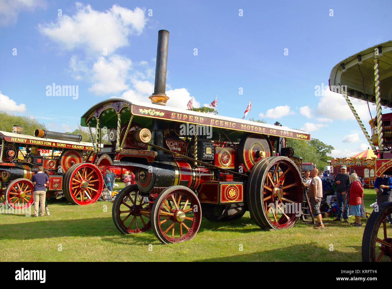 Welland Steam Fair, near Malvern, Worcestershire, with all kinds of farming vehicles and fairground engines on display. Seen here are two brightly coloured fairground engines. Stock Photo