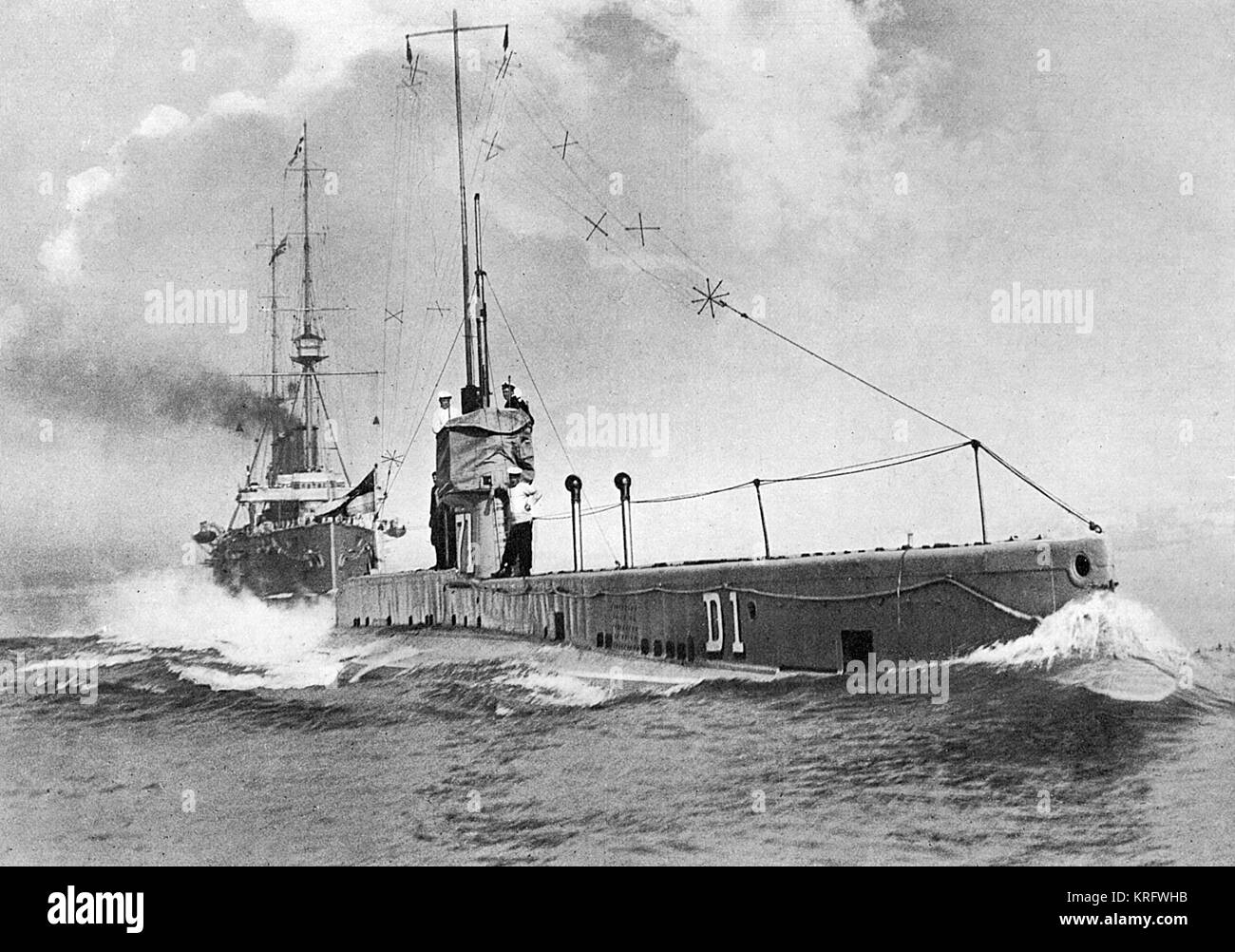 British submarine 'D 1' with H.M.S. 'Drake' following in her wake.  All the latest British submarines during the First World War period were fitted with wireless telegraphy.       Date: 1914 Stock Photo