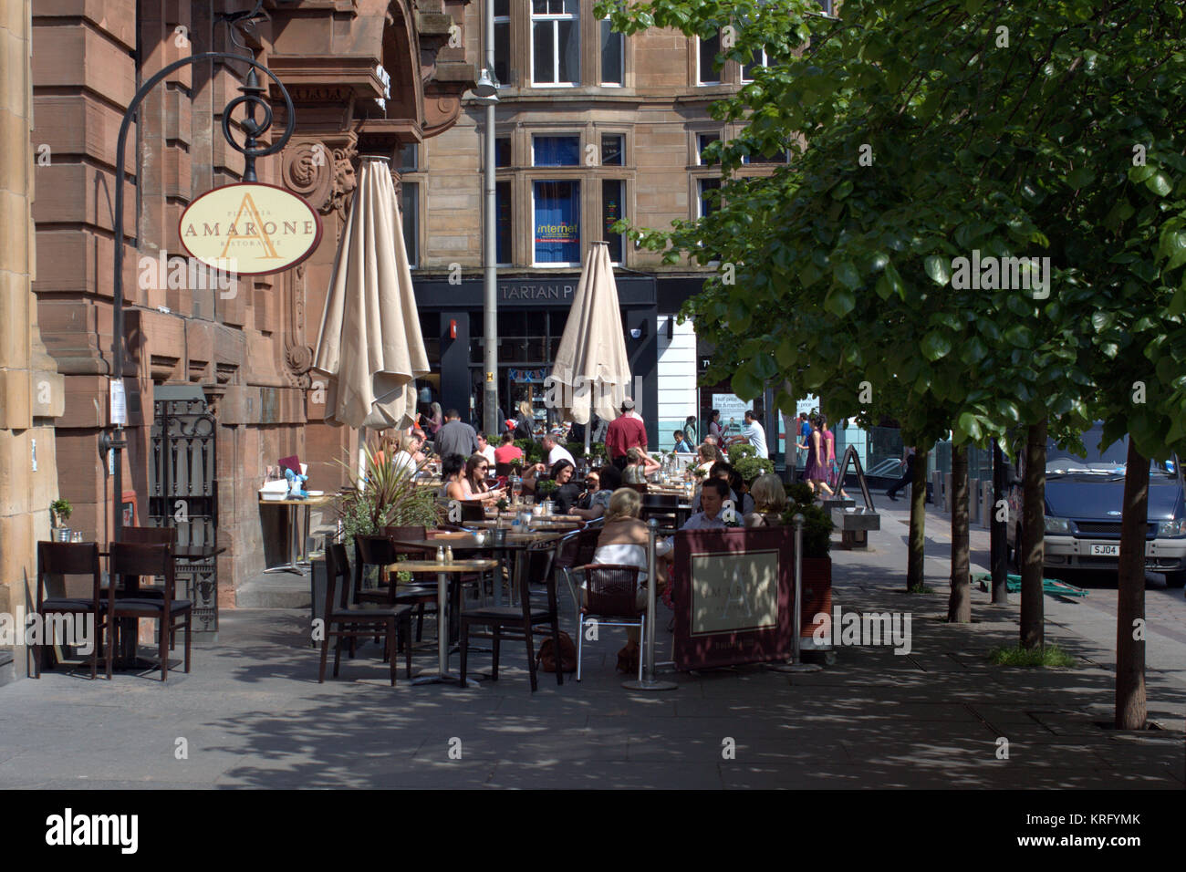 cafe amarone tables outside customers diners patrons sunny everyday British street scene Glasgow Nelson Mandela Place, just off Buchanan Street Stock Photo