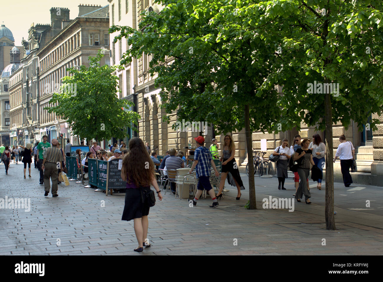 girl people walking sunny everyday British street scene Gordon Street Glasgow Stock Photo
