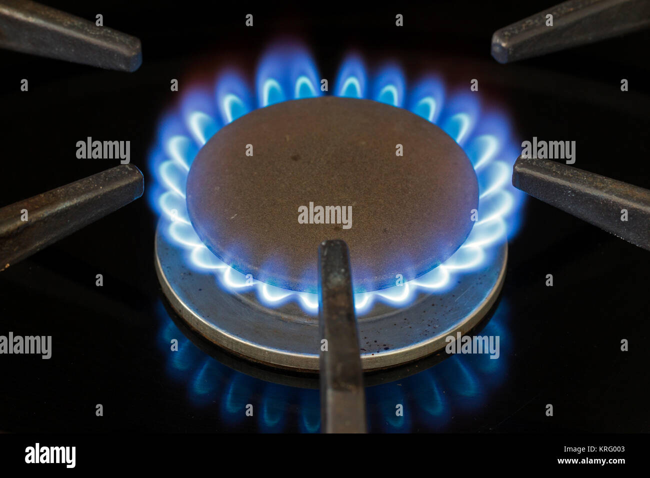 Blue natural gas flame on a domestic cooker gas hob Stock Photo