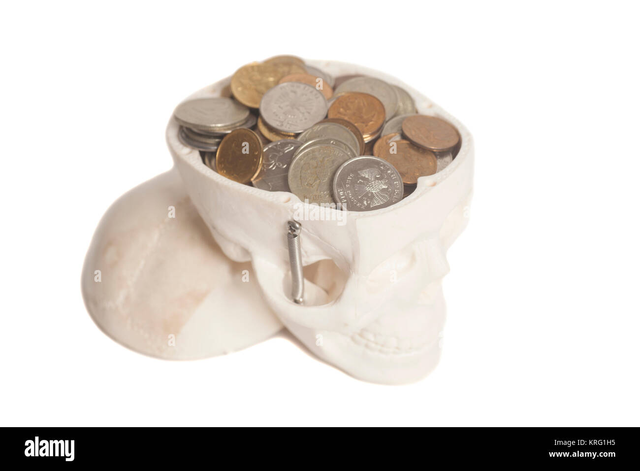 Coins in skulls head isolated on a white background Stock Photo Alamy