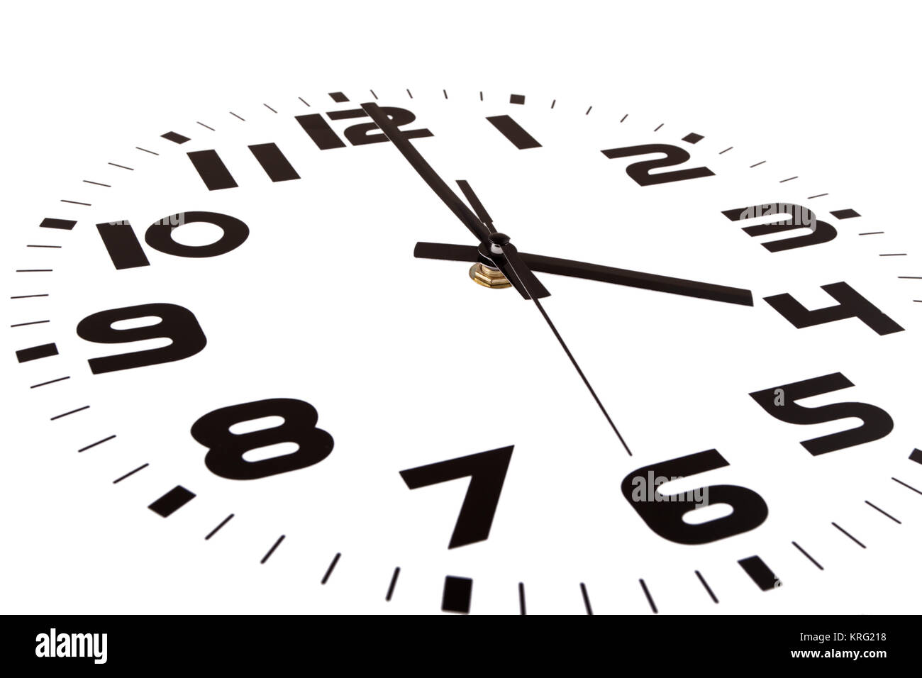 Clock isolated on white marking the four o'clock hour. The main focus