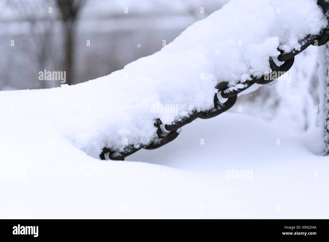 Snowcovered metal chain on the white snowy background Stock Photo Alamy