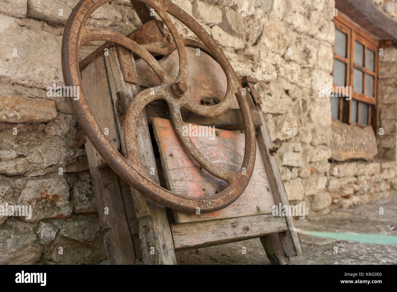 old rusted metal wheel of sewing machine Stock Photo