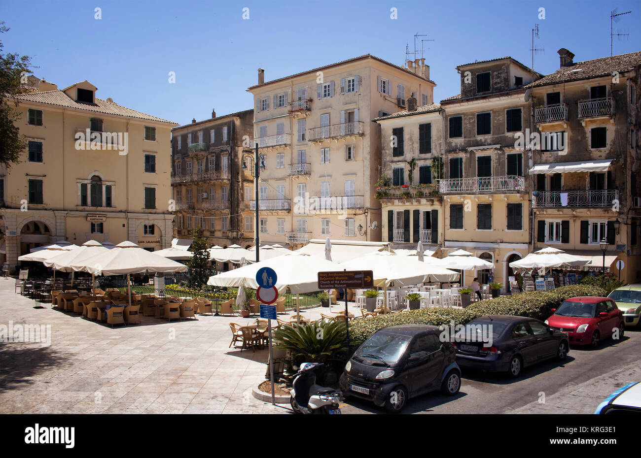 View of cafes, cars and old, historical buildings in Corfu (Kerkyra