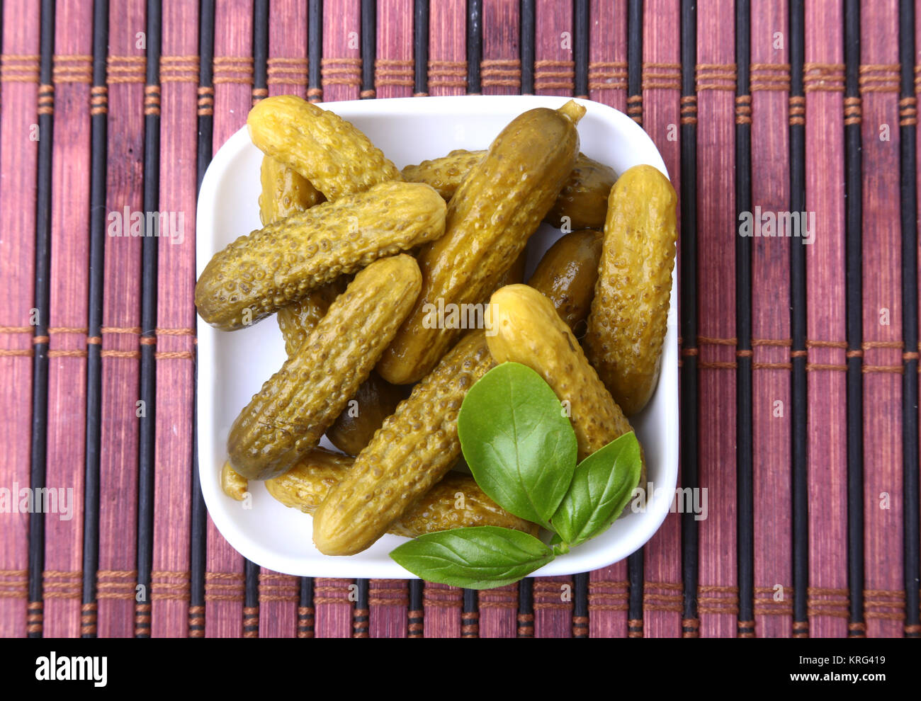 Pickles. Bowl of pickled gherkins cucumber with copy space. Cornichons