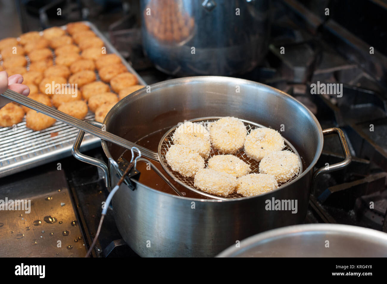 Crab cakes in a frying pan Stock Photo Alamy