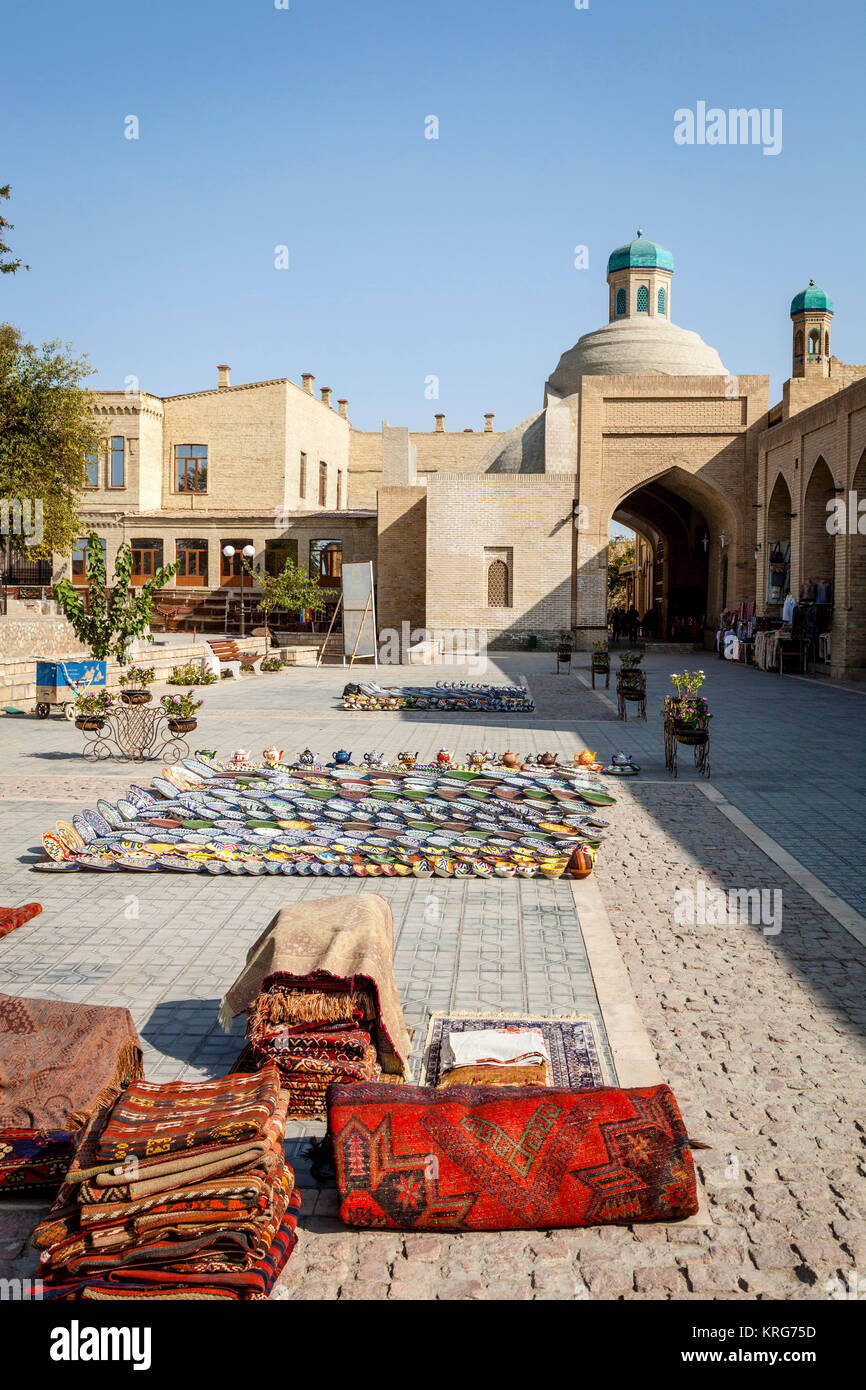 Carpets and Plates For Sale In The Street, Bukhara, Uzbekistan Stock Photo