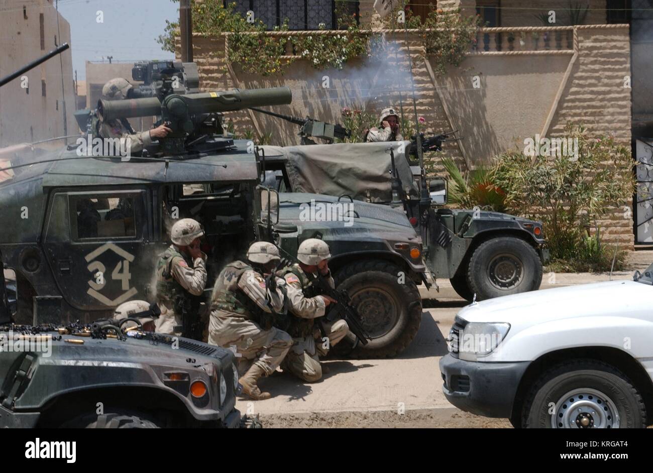 U.S. soldiers fire a TOW missile at the building where Uday Hussein and Qusay Hussein have barricaded themselves July 22, 2003 in Mosul, Iraq. Stock Photo