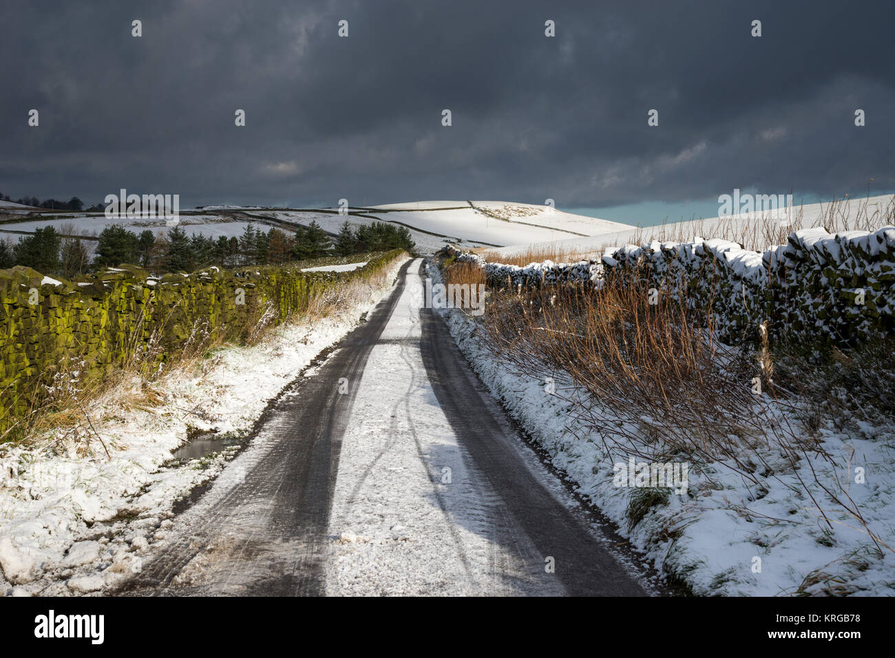 Icy country road in Northern England on a cold winter morning. Stock Photo