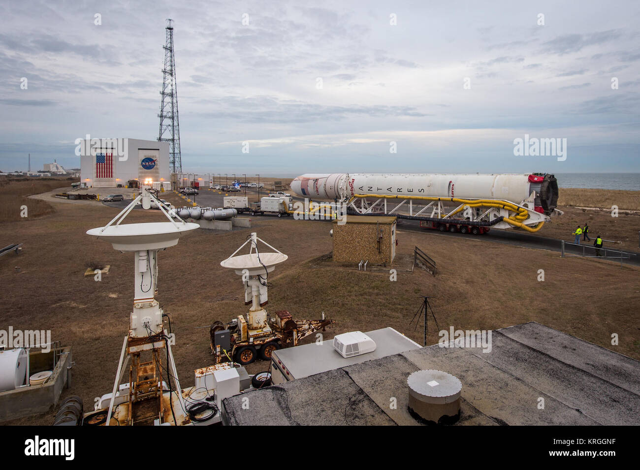 An Orbital Sciences Corporation Antares rocket is seen as it is rolled out to launch Pad-0A at NASA's Wallops Flight Facility, Sunday, January 5, 2014 in advance of a planned Wednesday, Jan. 8th, 1:32 p.m. EST launch, Wallops Island, VA. The Antares will launch a Cygnus spacecraft on a cargo resupply mission to the International Space Station. The Orbital-1 mission is Orbital Sciences' first contracted cargo delivery flight to the space station for NASA. Among the cargo aboard Cygnus set to launch to the space station are science experiments, crew provisions, spare parts and other hardware. Ph Stock Photo