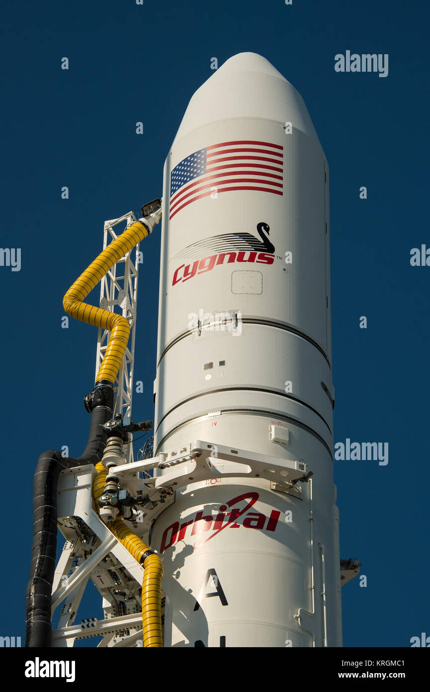 The Orbital Sciences Corporation Antares rocket, with the Cygnus spacecraft onboard, is seen, Saturday, July 12, 2014, at launch Pad-0A of NASA's Wallops Flight Facility in Virginia. The Antares will launch with the Cygnus spacecraft filled with over 3,000 pounds of supplies for the International Space Station, including science experiments, experiment hardware, spare parts, and crew provisions. The Orbital-2 mission is Orbital Sciences' second contracted cargo delivery flight to the space station for NASA. Photo Credit: (NASA/Bill Ingalls) Antares Orb-2 being prepped at Wallops pad (201407120 Stock Photo