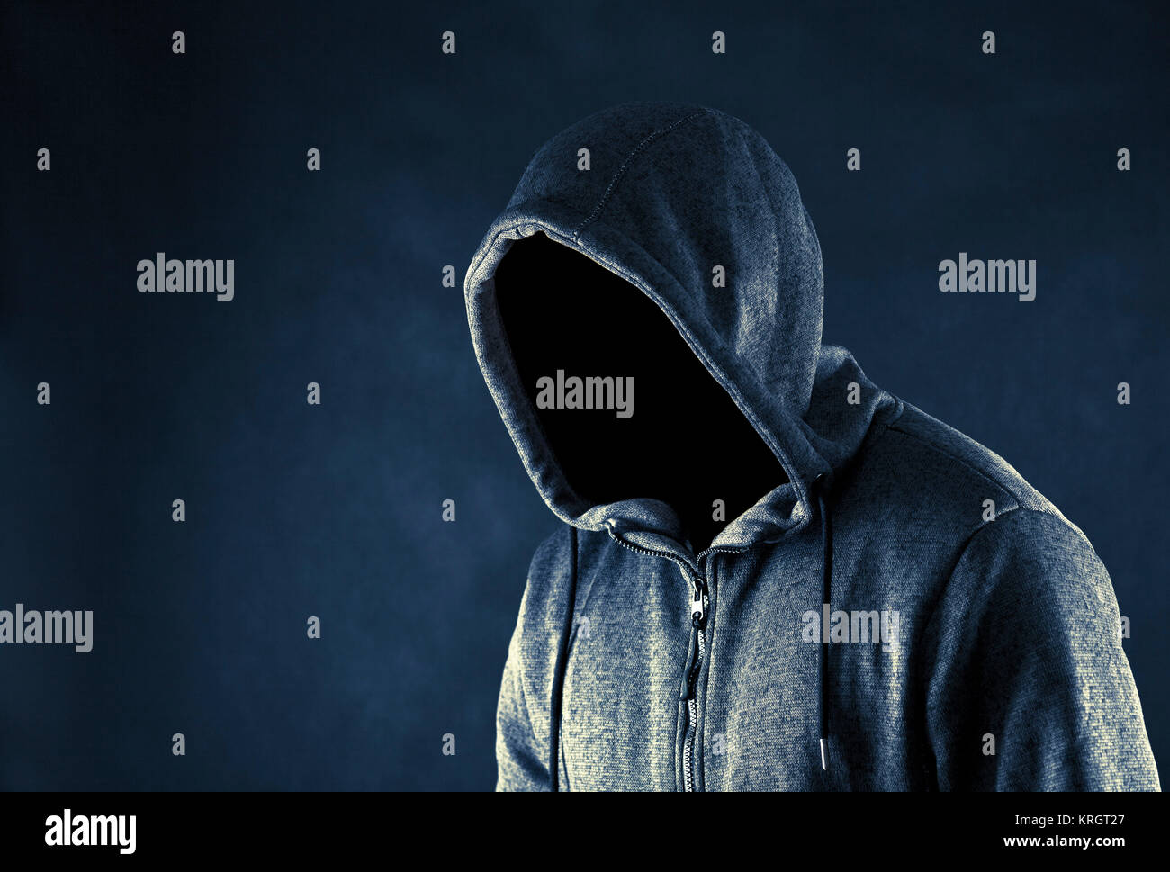 Hooded man in the dark Stock Photo Alamy