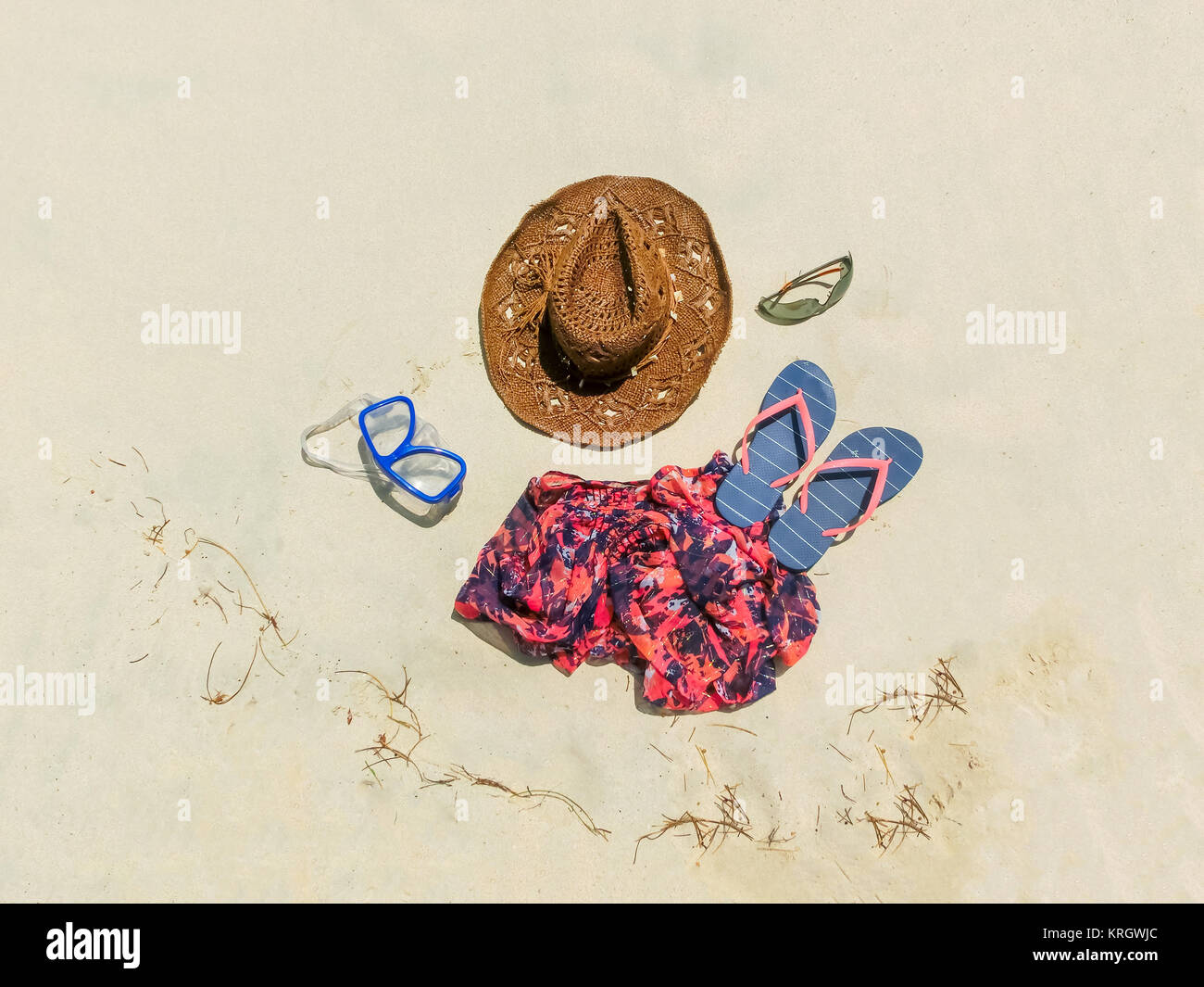 Straw hat, mask. sunglasses and dress on a tropical beach Stock Photo ...