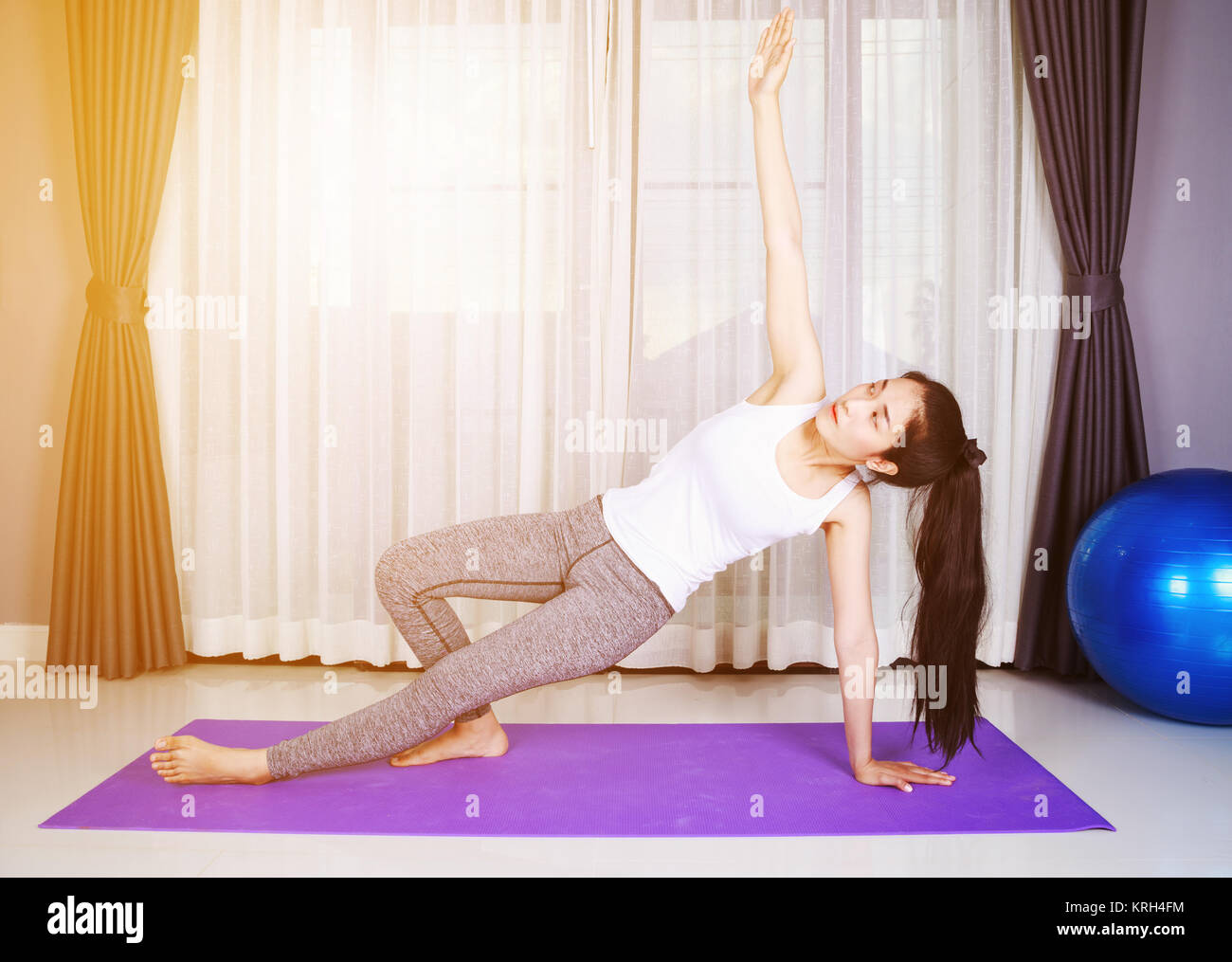 young woman doing yoga exercise isolated on a white background Stock ...