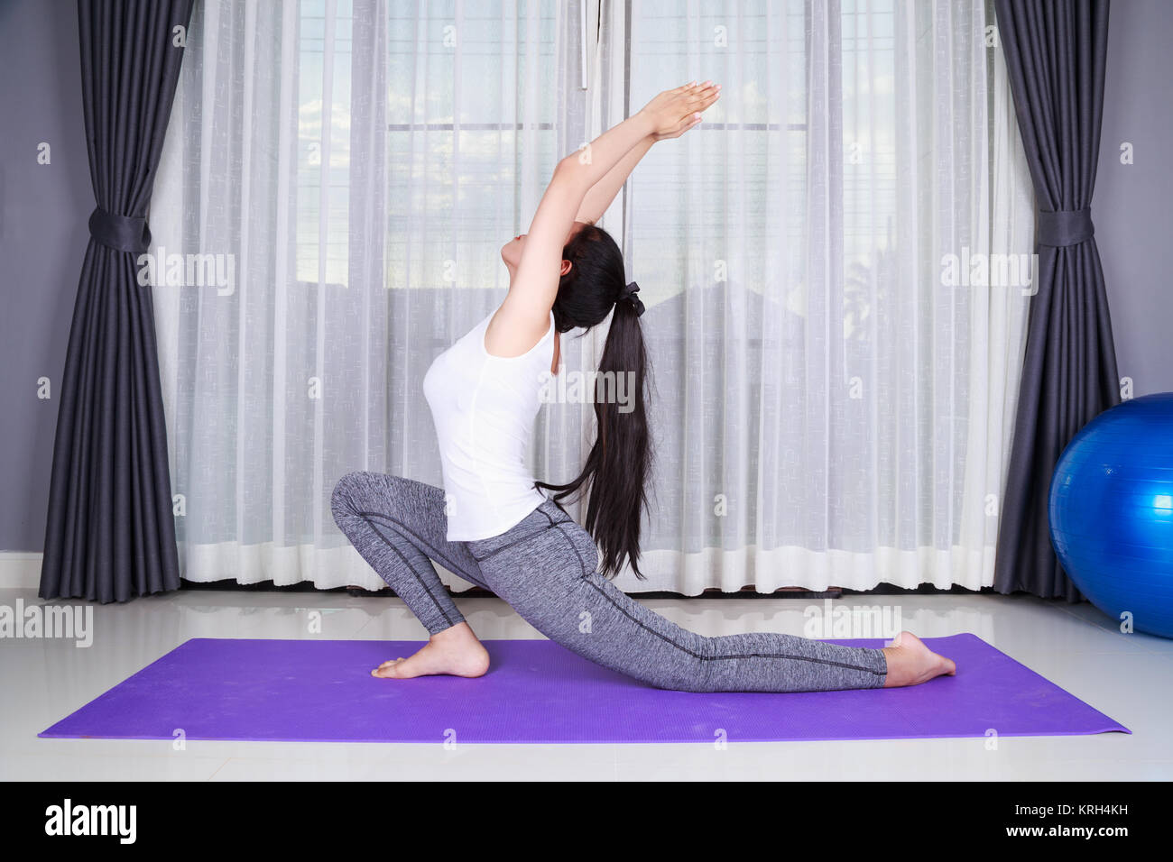 young woman doing yoga exercise isolated on a white background Stock ...