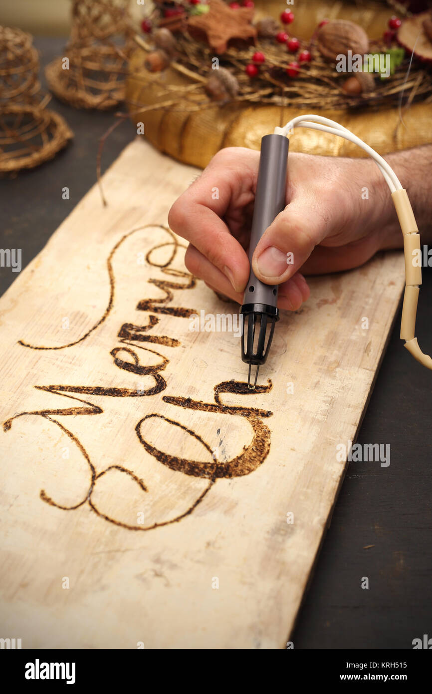 burning subtitles in wood Stock Photo