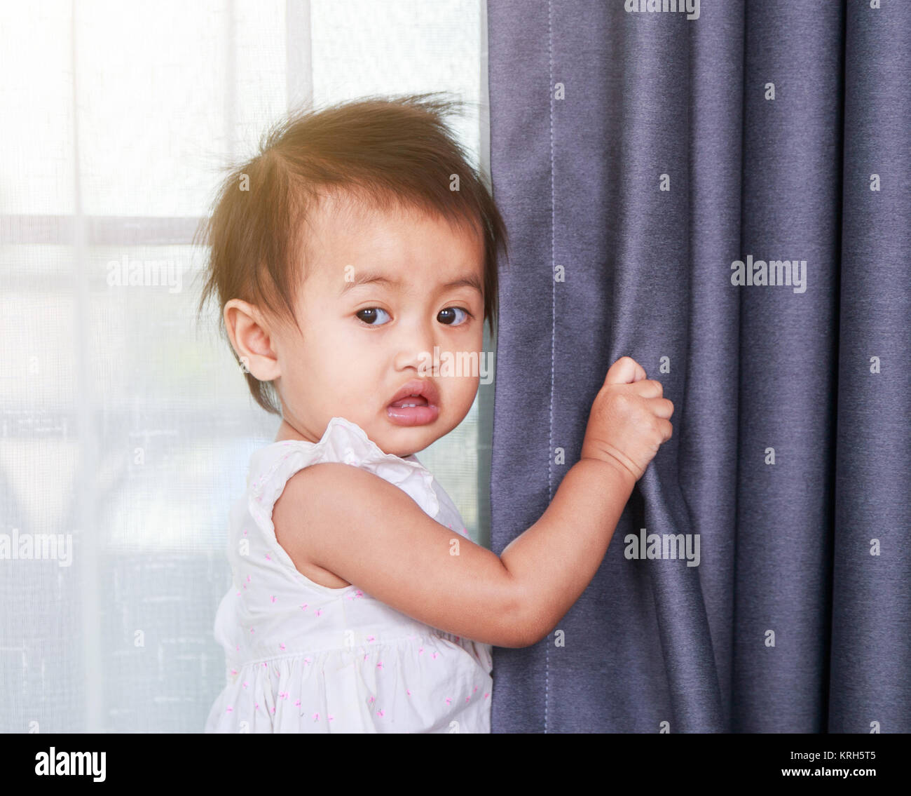 portrait of baby near the window at home Stock Photo Alamy