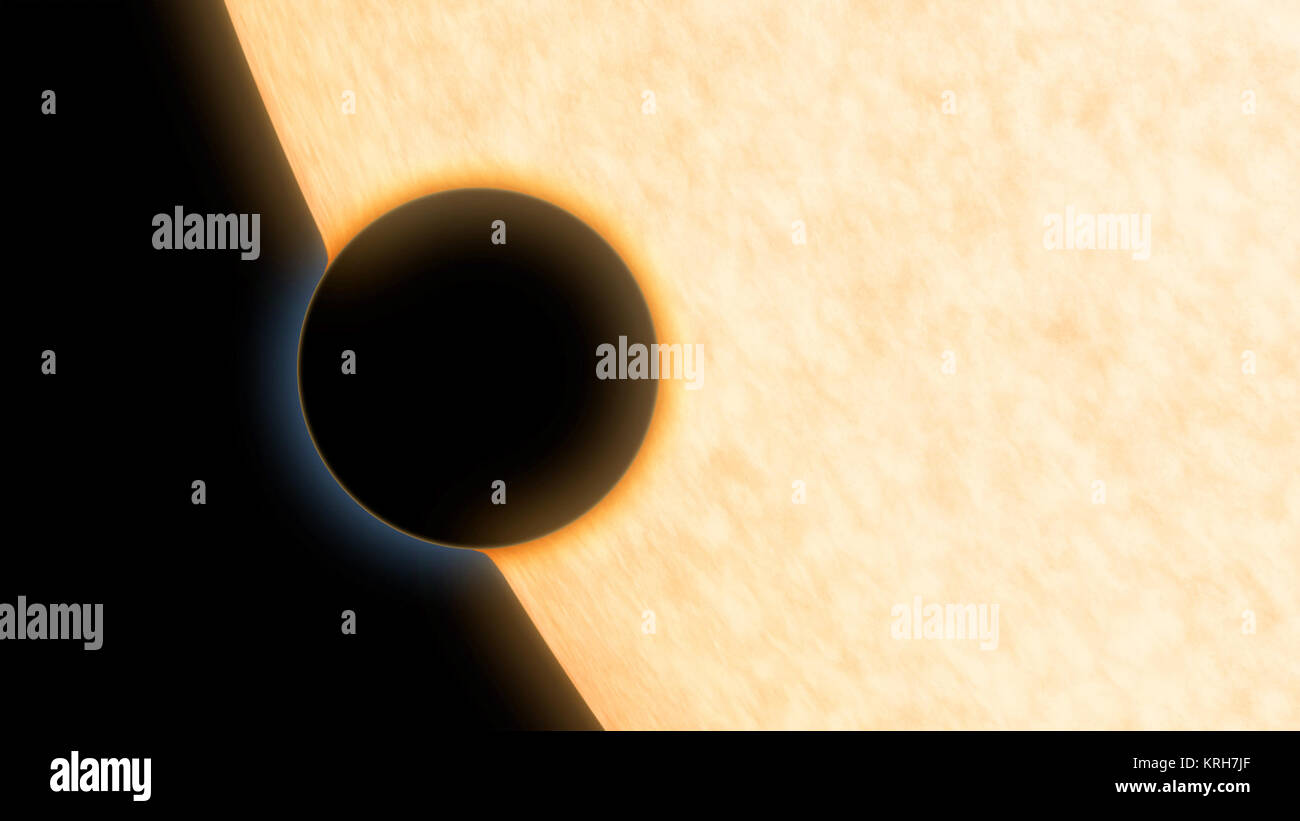 This is an artist's concept of the silhouette of the extrasolar planet HAT-P-11b as it passes its parent star. The planet was observed as it crossed in front of its star in order to learn more about its atmosphere. In this method, known as transmission or absorption spectroscopy, starlight filters through the rim of the planet's atmosphere and into the telescope. If molecules like water vapour are present, they absorb some of the starlight, leaving distinct signatures in the light that reaches our telescopes. Using this technique, astronomers discovered clear skies and steamy water vapour on t Stock Photo
