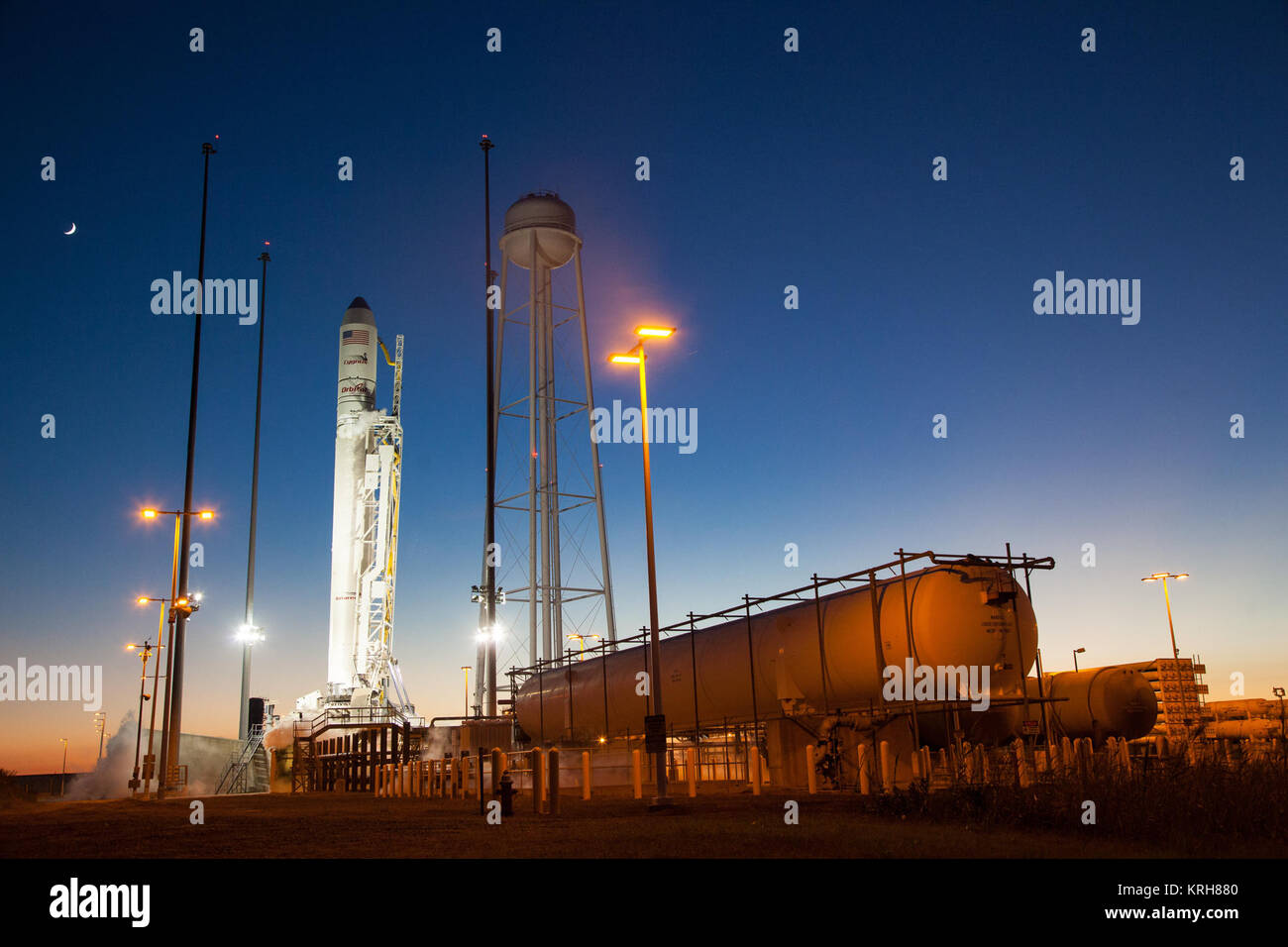 The Orbital Sciences Corporation Antares rocket, with the Cygnus spacecraft onboard, is seen on launch Pad-0A after the launch attempt was scrubbed because of a boat down range in the trajectory Antares would have flown had it lifted off, Monday, Oct. 27, 2014, at NASA's Wallops Flight Facility in Virginia. The Antares will launch with the Cygnus spacecraft filled with over 5,000 pounds of supplies for the International Space Station, including science experiments, experiment hardware, spare parts, and crew provisions. The Orbital-3 mission is Orbital Sciences' third contracted cargo delivery  Stock Photo