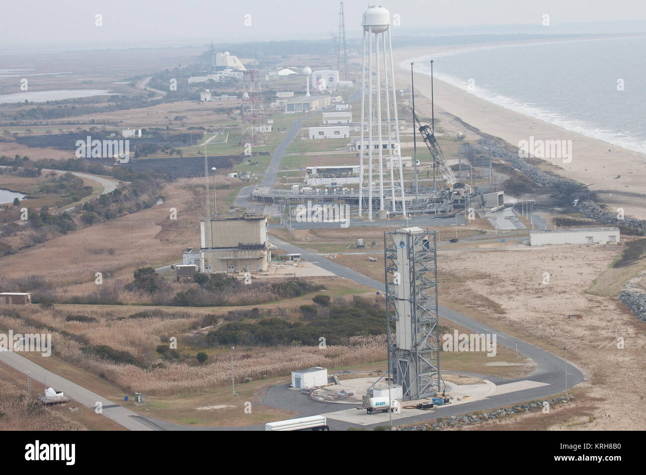 An aerial view of the Wallops Island launch facilities taken by the Wallops Incident Response Team Wednesday, Oct. 29, 2014 following the failed launch attempt of Orbital Science Corp.'s Antares rocket Oct. 28, Wallops Island, VA. Photo Credit: (NASA/Terry Zaperach) Aftermath of Antares Orb-3 explosion at Pad 0A (20141029b) Stock Photo