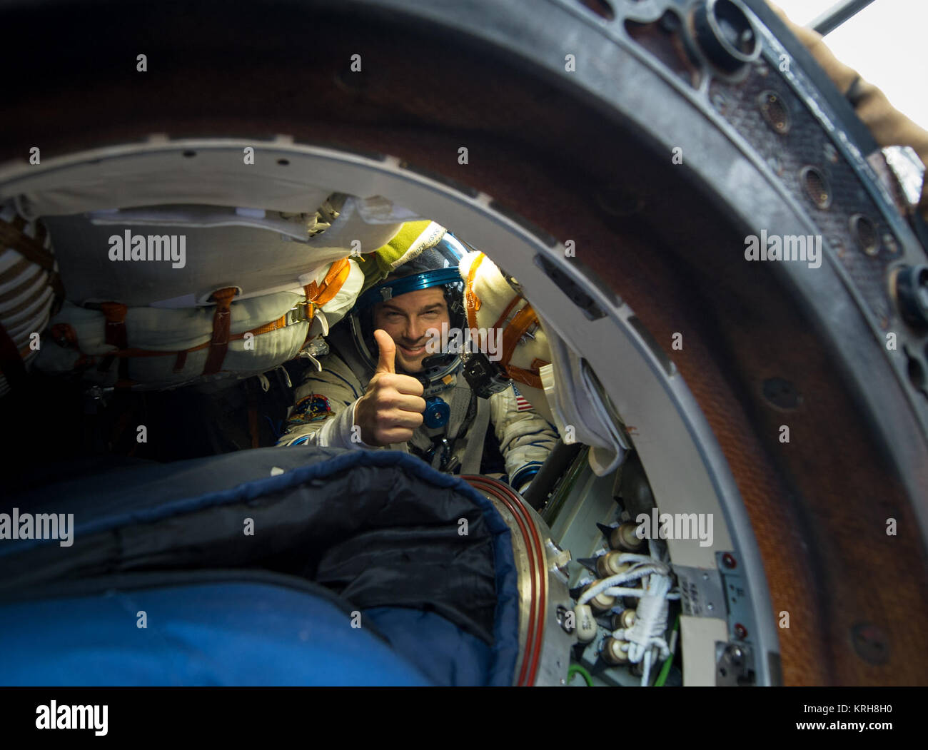 Expedition 41 Flight Engineer Reid Wiseman of NASA gives a thumbs up from inside the Soyuz Capsule just minutes after he and Expedition 41 Commander Max Suraev of the Russian Federal Space Agency (Roscosmos) and Flight Engineer Alexander Gerst of the European Space Agency (ESA) landed in their Soyuz TMA-13M capsule in a remote area near the town of Arkalyk, Kazakhstan on Monday, Nov. 10, 2014. Suraev, Wiseman and Gerst returned to Earth after more than five months onboard the International Space Station where they served as members of the Expedition 40 and 41 crews. Photo Credit: (NASA/Bill In Stock Photo