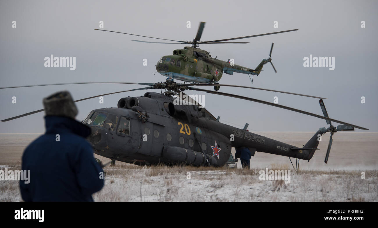 Russian search and rescue helicopters continue to arrive at the landing site after the Soyuz TMA-13M spacecraft landed with Expedition 41 Commander Max Suraev of the Russian Federal Space Agency (Roscosmos), NASA Flight Engineer Reid Wiseman and Flight Engineer Alexander Gerst of the European Space Agency (ESA) near the town of Arkalyk, Kazakhstan on Monday, Nov. 10, 2014. Suraev, Wiseman and Gerst returned to Earth after more than five months onboard the International Space Station where they served as members of the Expedition 40 and 41 crews. Photo Credit: (NASA/Bill Ingalls) Expedition 41  Stock Photo