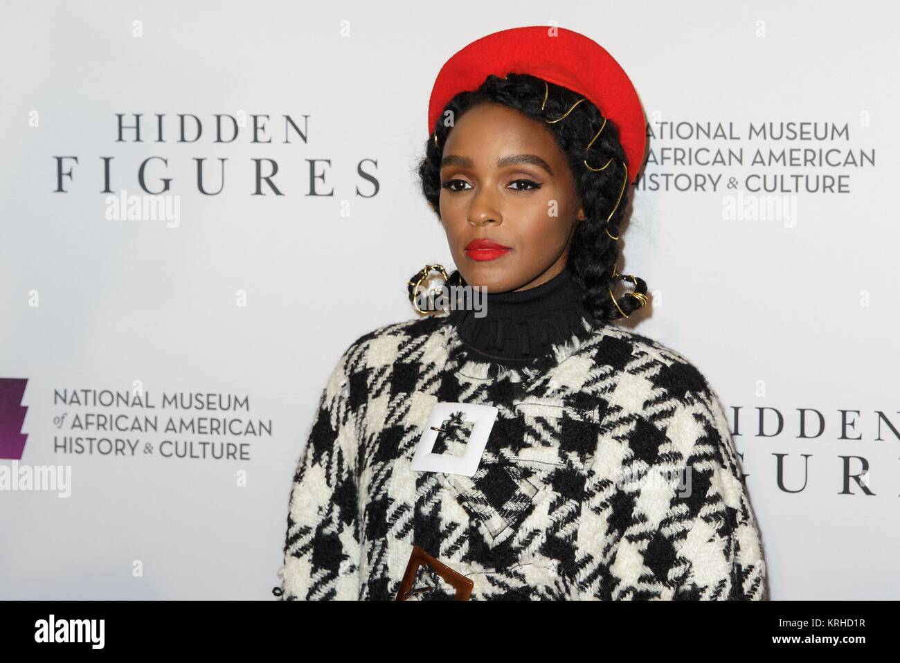 Actress and model Janelle Monae walks the red carpet during a screening of the film Hidden Figures at the Smithsonian National Museum of African American History and Culture December 14, 2016 in Washington, DC. The film is based on the lives of three African-American mathematicians who worked for NASA during the John Glenn Friendship 7 mission in 1962. Stock Photo