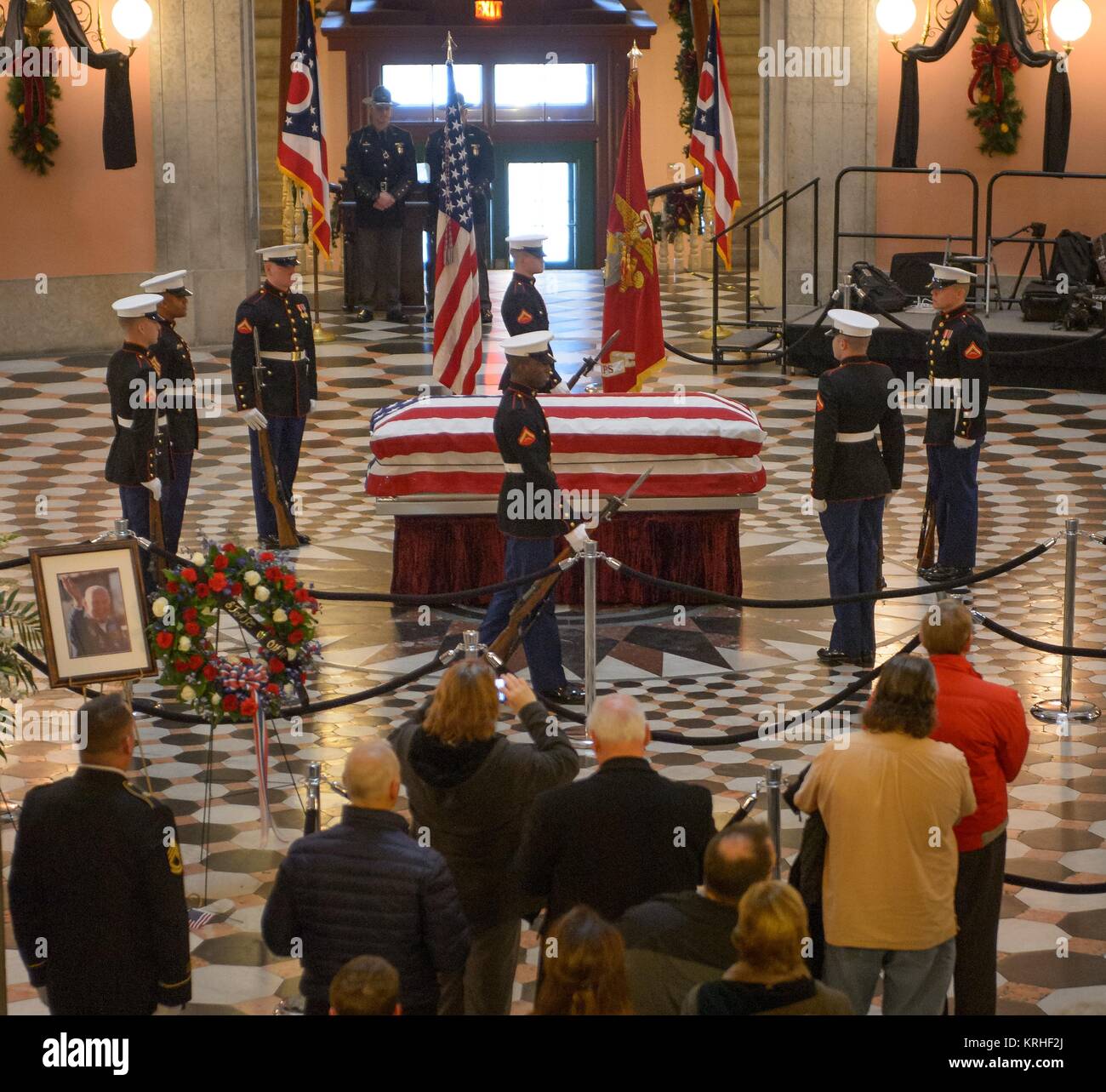 The U.S. Marine Honor Guard performs a Changing of the Guard around the casket of former NASA astronaut and U.S. Senator John Glenn at the Ohio Statehouse Rotunda December 16, 2016 in Columbus, Ohio. Stock Photo