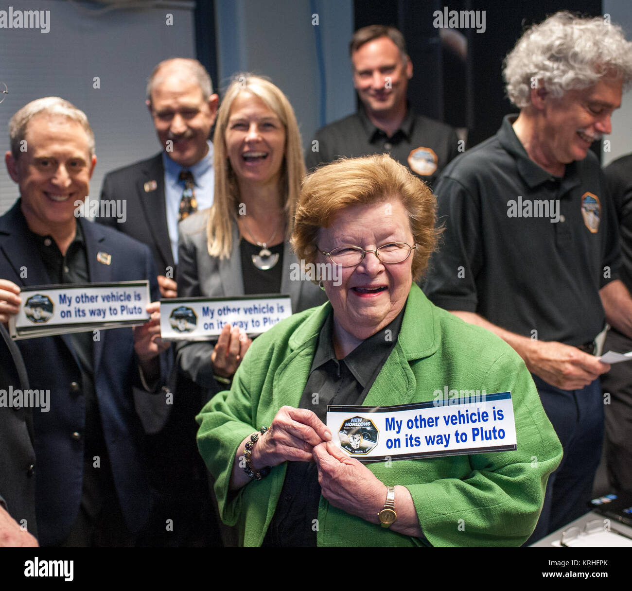 Sen. Barbara Mikulski, D-Md. holds a bumper sticker given to her by members of the New Horizons team at the Johns Hopkins University Applied Physics Laboratory (APL) Monday, July 13, 2015 at APL in Laurel, Maryland. Also in the photograph are: Johns Hopkins University Applied Physics Laboratory (APL) Director Ralph Semmel, left, New Horizons Principal Investigator Alan Stern of Southwest Research Institute (SwRI), Boulder, CO., Associate Administrator for the Science Mission Directorate John Grunsfeld, and NASA Deputy Administrator Dava Newman. Photo Credit: (NASA/Bill Ingalls) Sen Mikulski at Stock Photo