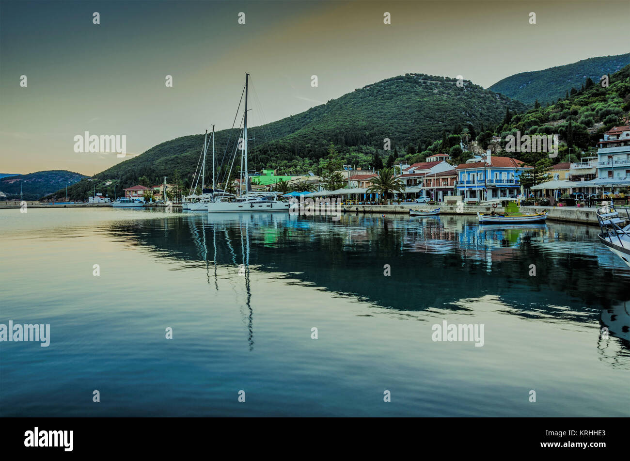 Panoramic view of the port of Sami with the boats moored in the docks the buildings of the port and in the background the mountains of the island of K Stock Photo