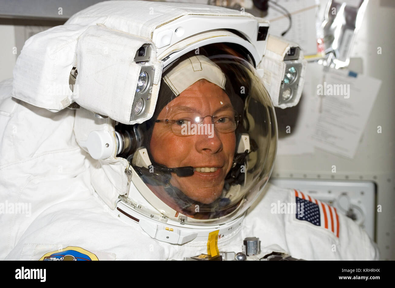 NASA Space Shuttle Discovery International Space Station STS-121 mission prime crew member American astronaut Michael Fossum prepares for his extravehicular activity spacewalk in the ISS Quest Airlock July 8, 2006 in Earth orbit. Stock Photo