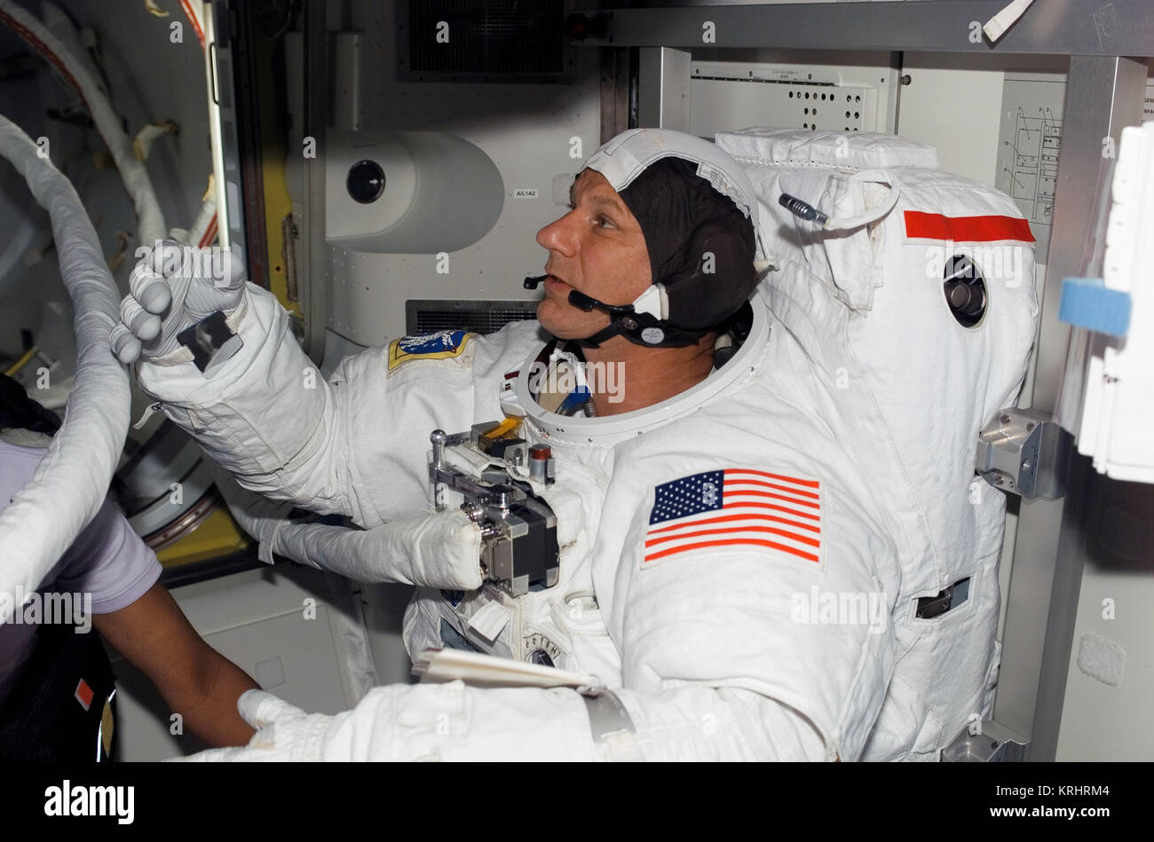 NASA Space Shuttle Discovery International Space Station STS-121 mission prime crew member American astronaut Piers Sellers prepares for an extravehicular activity spacewalk in the ISS Quest Airlock July 10, 2006 in Earth orbit. Stock Photo