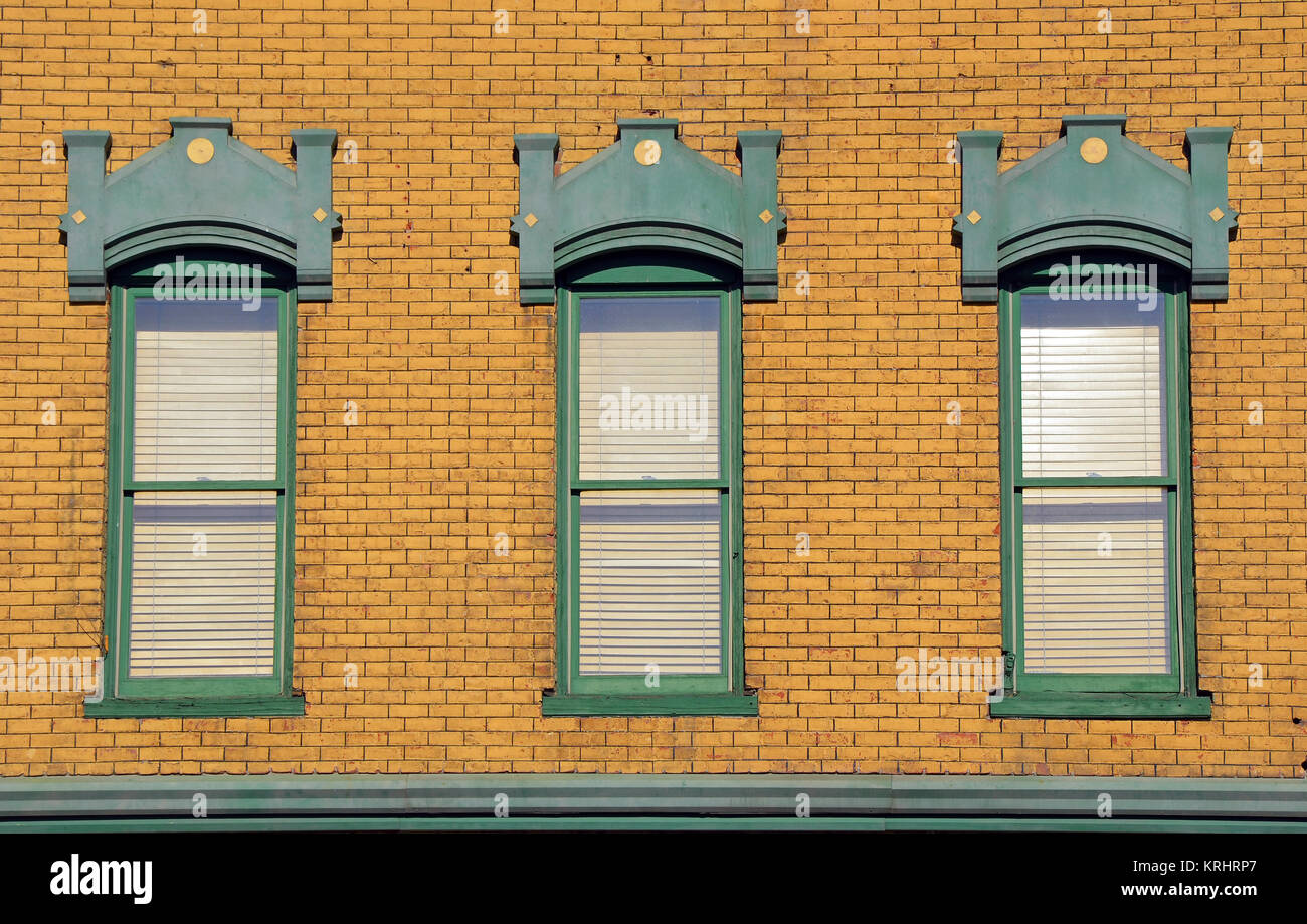 Old wooden windows in brick building wall Stock Photo - Alamy