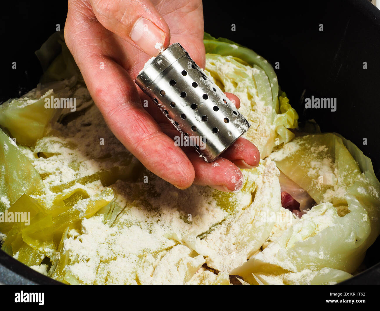 Lamm Rippe Chef preparing a traditional norwegian dish, lamb and cabbage with ...