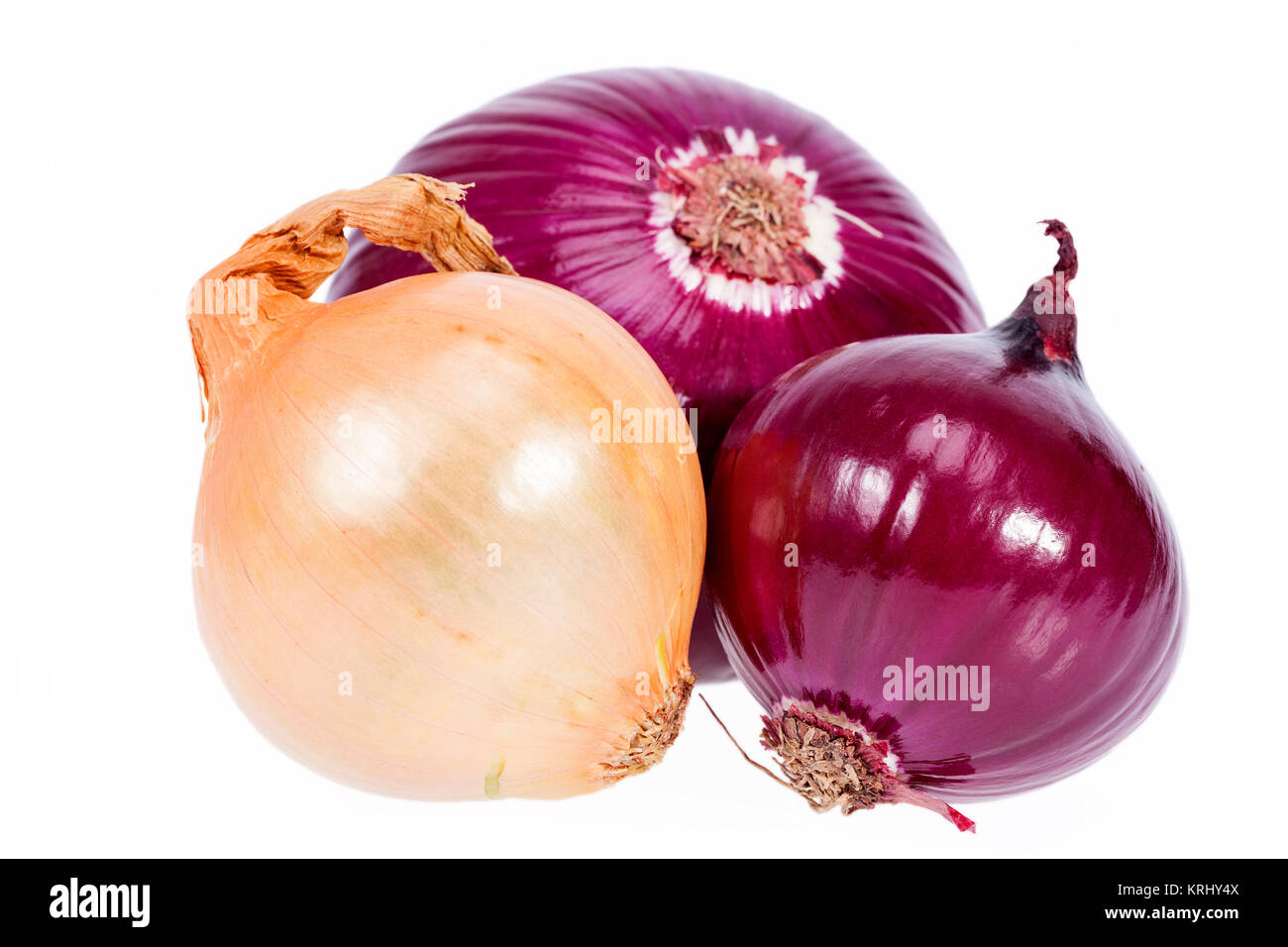 Group of red and yellow onions on white background Stock Photo - Alamy