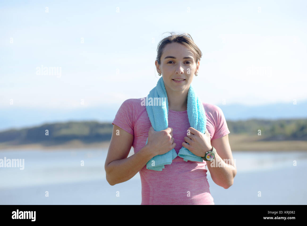 young sporty woman with blue towel in the countryside Stock Photo - Alamy